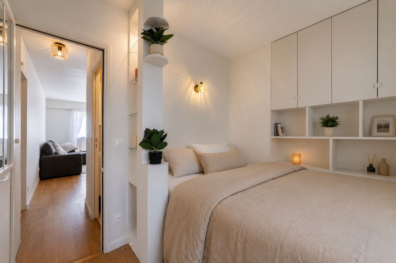 Bedroom with overhead storage and open niches above the bed, Paris